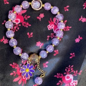 Purple flower charm beaded bracelet